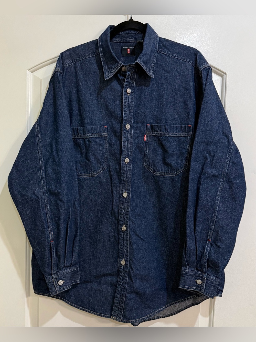 Vintage men’s metal button down blue jean shirt. Red tab. Size Large.